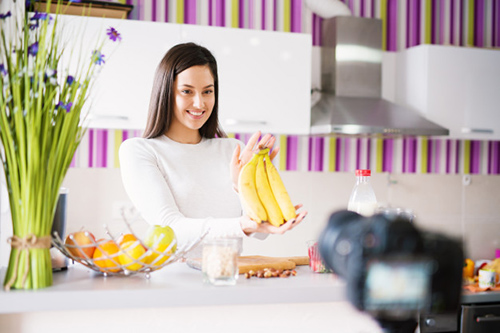 Foods that help with muscle cramps: Image of woman holding bananas