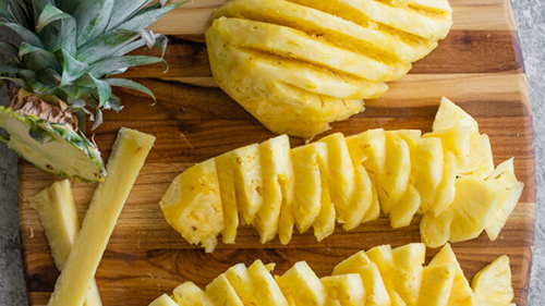 table filled with sliced pineapples