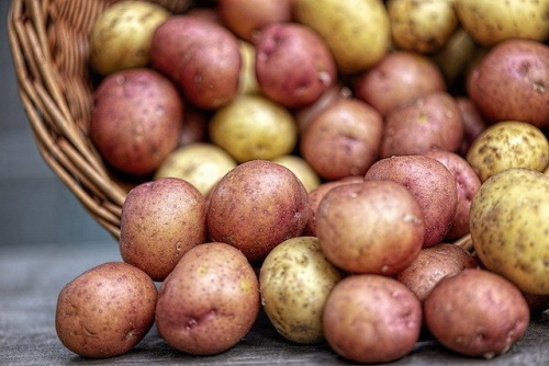 Foods to eat with gastritis: Image of stack of potatoes
