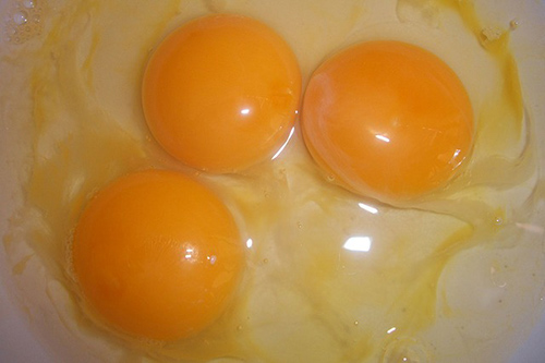 Foods that clog arteries: Image of three egg yolks.