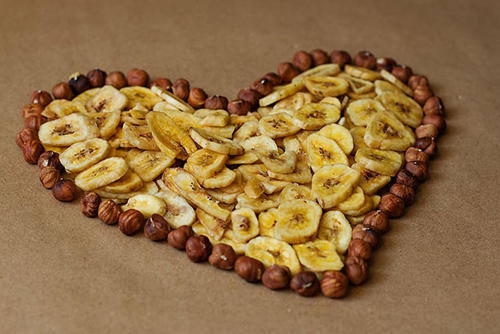 Heart-healthy diet: Image of bananas and nuts in the shape of a heart