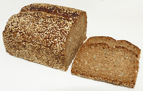 ways to increase fiber intake: Image of loaf of whole wheat bread