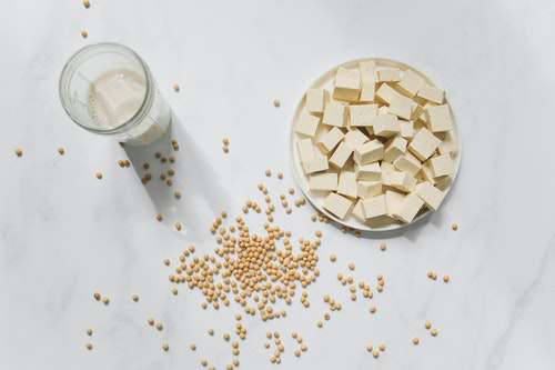 soy milk soybeans and soy milk on a table