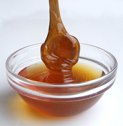 maltose syrup in small clear bowl that is brownish in color