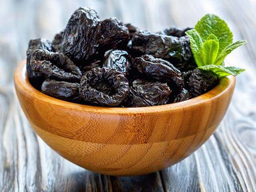 Large bowl of delicious prunes