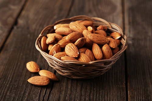 Basket weaved bowl of delicious and crunchy almonds