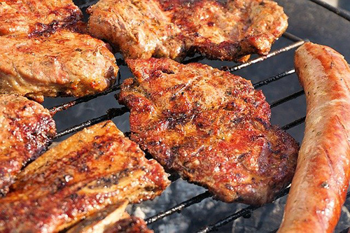 steak and sausages on the grill