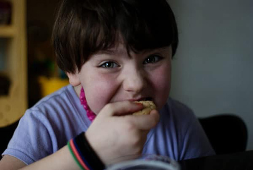 boy eating almond cookies