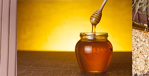 a jar full of honey on a table