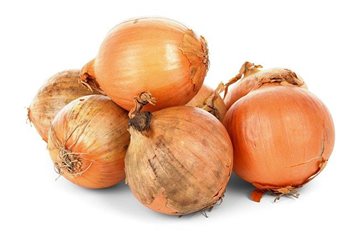 multiple onions on display waiting to be utilized in a stew or some delectable meal
