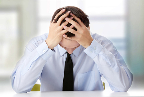 business man clearly suffering from chronic fatigue syndrome