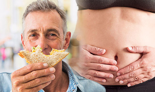man holding bread with bite mark and woman's stomach in background holding her stomach in pain