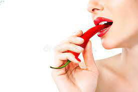 woman eating chili pepper