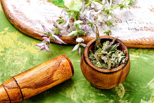 dried garden sage herbs in a bowl