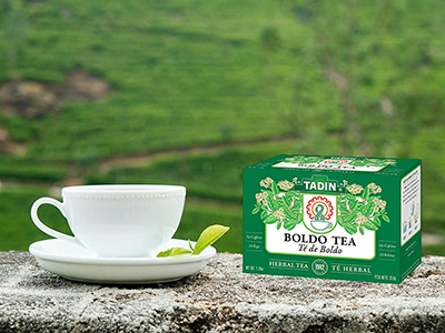 boldo tea in a teacup with tea box next to it