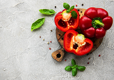 red bell peppers on a cutting board