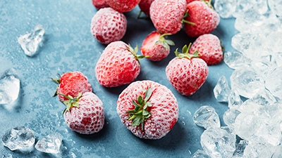 frozen strawberries along with ice cubes