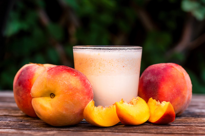 peaches and a glass of peach yogurt