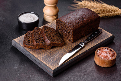 loaf of rye bread on a cutting board