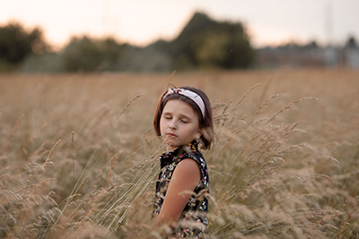 little girl in a rye field
