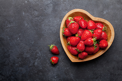 strawberries in a heart shaped bowl