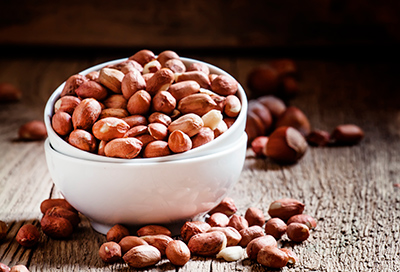 bowl of peanuts on a table