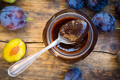 glass of plum jam