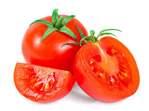 two tomatoes and one cut in half