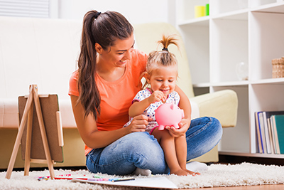 woman playing with young daughter on her lap