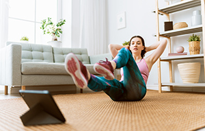 woman doing aerobics in her livingroom