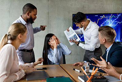 group of workers in office trying to resolve an issue