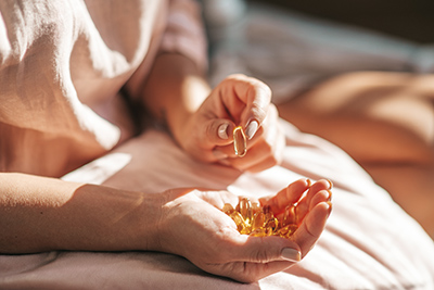 woman with supplements in her hands