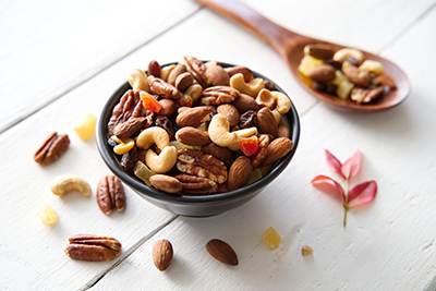 overflowing bowl of assorted nuts