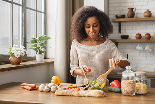 woman preparing food on a vegetarian diet