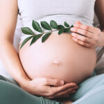 pregant woman showing her baby bump