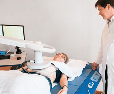 doctor visiting woman going through hyperthermia cancer therapy