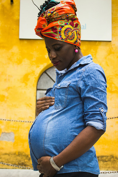 woman admiring her pregnant stomach