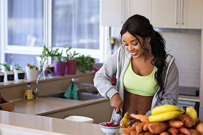 woman preparing a healthy meal in her kitchen