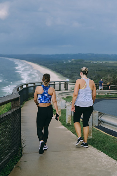 two women exercising with a moderate outdoor walk