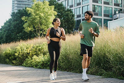 a man and woman enjoying a jog on a wonderful morning