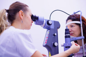 woman having eye checked by a specialist