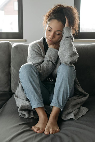 woman feeling ill with a fever