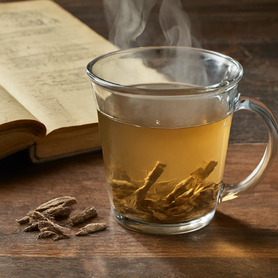 a glass teacup of Butcher's Broom root tea