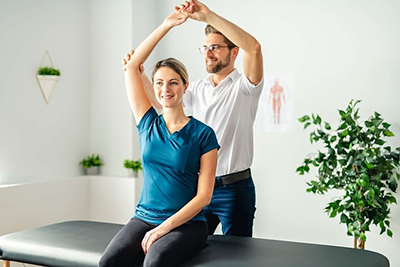 chiropractor stretching a woman