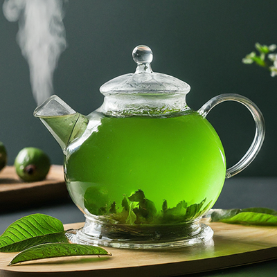 guava tea in a glass tea pot