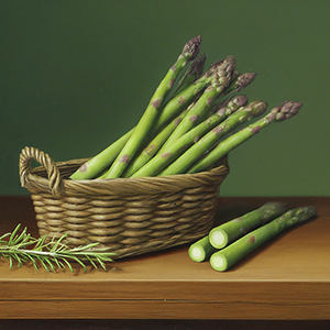 a bunch of asparagus in a basket