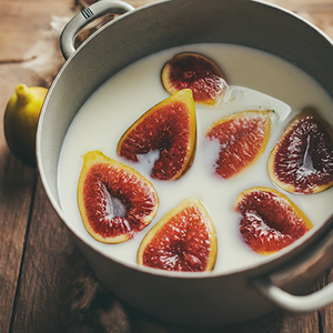 pot filled with boiled milk and figs
